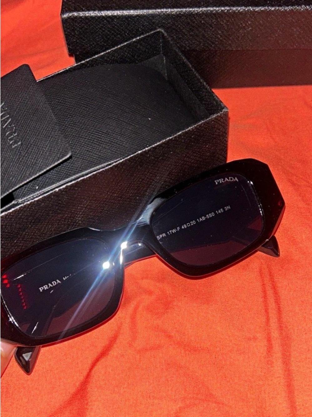 Prada Black Sunglasses with Dark Lenses
